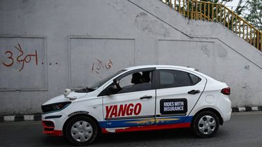 This photograph taken on April 29, 2026 shows passengers riding an electric Yango taxi along a street in Kathmandu. As global fuel markets reel from the Middle East war, motorists in Nepal are increasingly turning to electric vehicles, with high demand putting a strain on dealerships.
Prakash MATHEMA / AFP