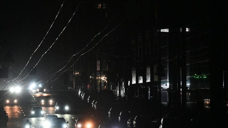 Cars drive in a dark street during a blackout in Kyiv on October 8, 2026, amid the Russian invasion in Ukraine. The Kyiv City State Administration said reduced voltage in the power grid had forced the temporary suspension of some public transport services in the capital.
Sergei SUPINSKY / AFP