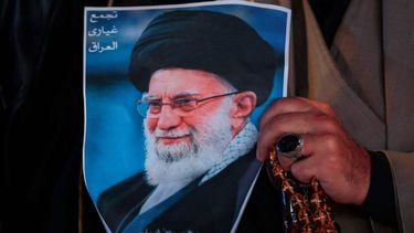 A Shiite Muslim man hold a poster of the late Iranian supreme leader Ayatollah Ali Khamenei, assassinated in a US- Israeli attack on Tehran, and a set of prayer beads during a rally in Tahrir Square, in the Baghdad on March 6, 2026.  The United States and Israel launched strikes against Iran on February 28, killing Iran's supreme leader and top military leaders, prompting authorities to retaliate with strikes on Israel and across the Gulf. Fresh strikes rocked Iran and Lebanon on March 6, as Israel and the United States stepped up their attacks in the sprawling Middle East war, with powerful explosions shattering the skies of Tehran.
Murtaja LATEEF / AFP