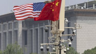 epa12955894 The US (L) and Chinese flags flutter at Tiananmen Square, in Beijing, China, 14 May 2026. US President Trump is in Beijing for a high-stakes state visit running through 15 May, marking his first return to the mainland since 2017.  EPA/ANDRES MARTINEZ CASARES