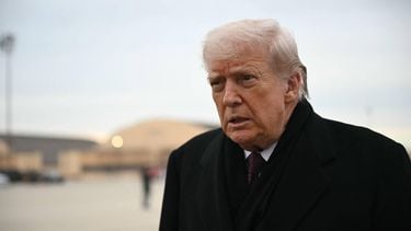US President Donald Trump speaks to reporters after stepping off Air Force One at Joint Base Andrews on December 17, 2025 upon return from Dover Air Force Base in Delaware where he attended a ceremony for the return of the remains of two Iowa National Guard members and a translator killed in an attack in Syria.  
ANDREW CABALLERO-REYNOLDS / AFP