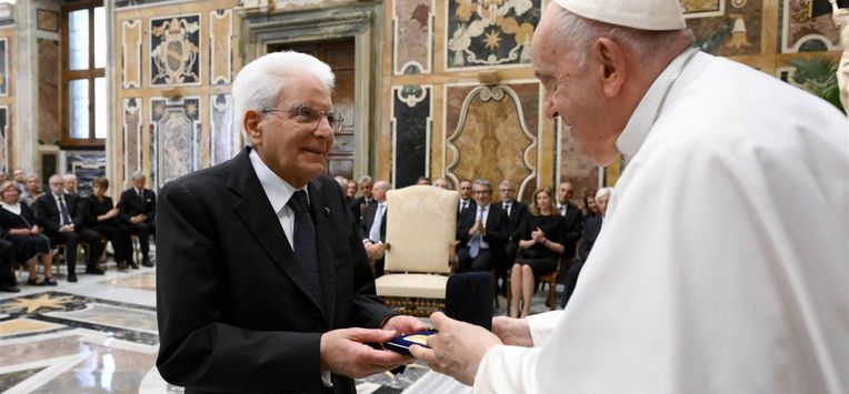 This handout photo taken and released by Vatican Media, the Vatican press office, on May 29, 2023, shows Pope Francis (R) presenting Paolo VI Prize to Italian Republic President Sergio Mattarella at the Vatican. 
VATICAN MEDIA / AFP