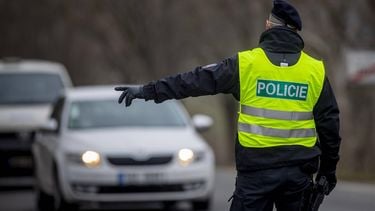 epa09044507 A police officer controls cars on the border between county of Prague and county of Central Bohemia, in Prague, Czech Republic, 01 March 2021. The Czech government tightened measures 01 March, to curb the spread of COVID-19 caused by the SARS-CoV-2 . One of the most significant restrictions is the ban of traveling between countis, with a few exceptions.  EPA/MARTIN DIVISEK