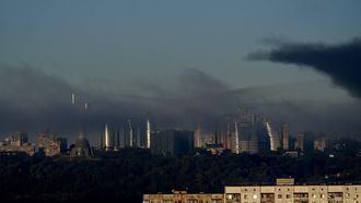 The Motherland Monument (L) and city skyline are seen through smoke rising above residential buildings following an air attack in Kyiv on September 23, 2026, amid the Russian invasion of Ukraine. 
Eugene KOTENKO / AFP