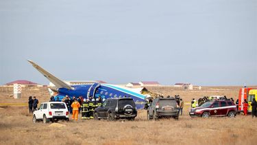Emergency specialists work at the crash site of an Azerbaijan Airlines passenger jet near the western Kazakh city of Aktau on December 25, 2024. 
Kamilla Jumayeva / AFP