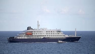 The hantavirus-stricken cruise ship MV Hondius leaves the port of Granadilla de Abona on the island of Tenerife in Spain's Canary Islands on May 11, 2026. Adverse weather conditions forced the cruise ship MV Hondius hit by a deadly hantavirus outbreak and anchored off Spain's Canary Islands to dock at Tenerife on May 11, 2026 before evacuations can be completed, the health ministry said.
JORGE GUERRERO / AFP