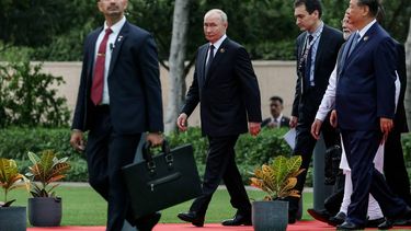 In this pool photograph distributed by the Russian state agency Sputnik, Russia's President Vladimir Putin (2L) walks alongside China's President Xi Jinping (R) and India's Prime Minister Narendra Modi (2R) during 18th BRICS Summit in New Delhi on September 12, 2026. 
Alexander KAZAKOV / POOL / AFP
