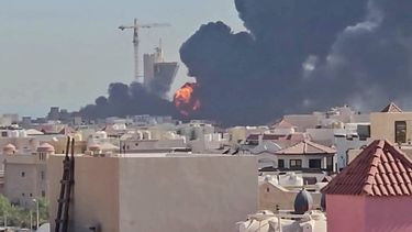 This screen grab taken from UGC video footage posted on social media on July 18, 2026, shows a plume of black smoke and flames billowing over the town of Mangaf, south of Kuwait City. Kuwait accused Iran on July 18 of targeting civilian sites and vital infrastructure in the country, after reporting attacks on an oil facility and a power and water plant.
UGC / UNKNOWN / AFP