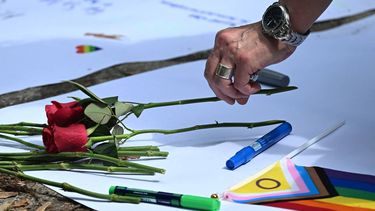 People lay flowers in commemoration of the victims on July 26, 2026 near the site in the Tiergarten park in Berlin, where a car was driven the evening before into people killing one person and injuring 16 on the outskirts of the Christopher Street Day (CSD) parade.
 German police searched on July 26, 2026 for a suspect believed linked to Islamist circles after a car ploughed into a crowd near Berlin's Gay Pride celebrations, killing one person and wounding 16 others. The incident shattered what had been a day of celebration for hundreds of thousands attending Christopher Street Day, one of Europe's largest Pride events, and left revellers fleeing a central Berlin park as sirens echoed through the night.

RALF HIRSCHBERGER / AFP