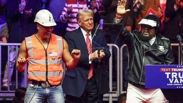epa11837535 US President-elect Donald Trump (C) on stage with James Kwong (L) and Victor Willis (R) of the group the Village People during a rally at Capital One Arena in Washington, DC, USA, 19 January 2025. President-elect Donald Trump, who defeated Joe Biden to become the 47th president of the United States, will be inaugurated on 20 January, though all of the planned outdoor ceremonies and events have been cancelled due to a forecast of extreme cold temperatures.  EPA/WILL OLIVER