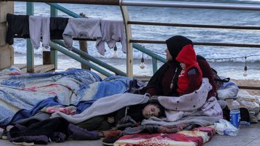 A woman sits with children wrapped in blankets in a makeshift encampment along the waterfront in Beirut on March 10, 2026, as civilians who fled the city's southern suburbs due to Israeli bombardment remain displaced. Lebanese authorities said on March 9 that Israel's attacks since March 2 have killed at least 486 people and wounded at least 1,313, with more than 660,000 registered as displaced and 120,000 sleeping at official shelters. Lebanon was drawn into the Middle East war when Iran-backed Hezbollah attacked Israel, in response to the killing of the Iranian supreme leader in US-Israeli strikes on February 28.
Anwar AMRO / AFP