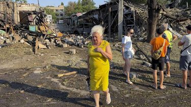 epa13160749 Local people view the site of a Russian attack on a residential area in Zaporizhzhia, Ukraine, 11 August 2026, amid the ongoing Russian invasion. At least six people were killed, and 19 others injured during the Russian combined attack by guided bombs and missiles on a residential area in Zaporizhzhia, according to the Zaporizhzhia Regional Military Administration.  EPA/DARYNA NAUMOVA