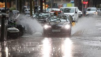A taxi drives during heavy rains in downtown Barcelona on September 29, 2026 in Barcelona, Catalonia.  
Josep LAGO / AFP