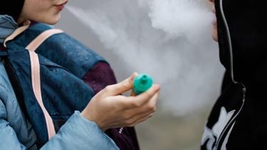 epa11245032 Children use vaping products in London, Britain, 26 March 2024. Tadeu Marroco, chief executive of British American Tobacco (BAT), claims the UK government's Tobacco and Vapes Bill, which will ban disposable vapes, will not be 'effective.' BAT is also calling for vape sellers to be licensed, and for licences to be taken away from firms caught selling to minors. Minimum age for legally buying vapes in the UK is 18.  EPA/TOLGA AKMEN