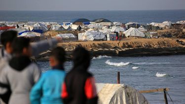 Boys look at the tents, housing displaced Palestinians in the Mawasi area of Khan Yunis, in southern Gaza Strip on January 30, 2026. The US-brokered ceasefire, which sought to halt the fighting between Israel and Hamas sparked by the group's October, 2023 attack has been in place for more than three months despite both sides accusing the other of repeated violations.
Bashar Taleb / AFP