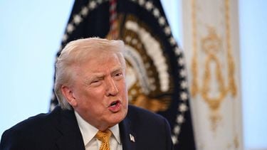 US President Donald Trump participates in calls to US service members, on Christmas Eve, from the Mar-a-Lago club in Palm Beach, Florida, December 24, 2025. 
ANDREW CABALLERO-REYNOLDS / AFP