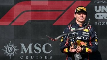Race winner Red Bull Racing's Dutch driver Max Verstappen holds the trophy on the podium after the United States Formula One Grand Prix at the Circuit of the Americas in Austin, Texas, on October 19, 2025. 
RONALDO SCHEMIDT / AFP