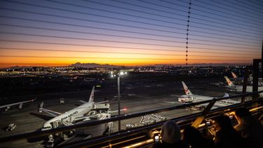 People take pictures as Japan Airlines (JAL) aircrafts are seen from the observation deck of Haneda Airport in Tokyo on February 28, 2023. 
Philip FONG / AFP