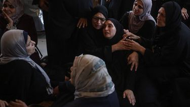 Displaced Palestinian women mourn loved ones reportedly killed in an Israeli airstrike during their funeral at Nasser Hospital in Khan Yunis, in the southern Gaza Strip, on June 17, 2026. A ceasefire has been in place in Gaza since October, but Israel reserves the right to strike targets it deems a threat. The territory remains gripped by daily violence as Israeli strikes continue, with both the military and Hamas accusing one another of violating the truce.
Bashar Taleb / AFP