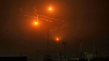 A picture taken from Rafah, on the southern Gaza Srip, shows flares dropped during Israeli bombardment on December 4, 2023, amid continuing battles between Israel and the Palestinian militant group Hamas. Israel has expanded its ground war on Hamas into the south of Gaza, witnesses said on December 4, despite global concern over mounting civilian deaths and fears the conflict will spread elsewhere in the Middle East.
SAID KHATIB / AFP