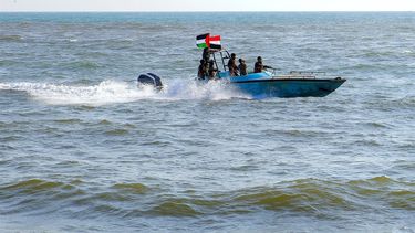 Members of the Yemeni Coast Guard affiliated with the Houthi group patrol the sea as demonstrators march through the Red Sea port city of Hodeida in solidarity with the people of Gaza on January 4, 2024, amid the ongoing battles between Israel and the militant Hamas group in Gaza. 
AFP