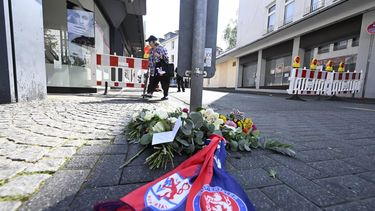 Flowers for the victims are placed on August 24, 2024 near the scene where at least three people were killed and several injured when a man attacked them with a knife on late August 23, 2024 in Solingen, western Germany, during a festival to mark the city's 650th anniversary. German police stepped up a major hunt for a man who stabbed three people to death and wounded eight others at the street festival, authorities said. Police closed off the centre of Solingen after the attack at the city's 