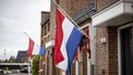 HOLTEN - Een Nederlandse vlag hangt halfstok op 4 mei voor Dodenherdenking. ANP WOUTER DE WILDE