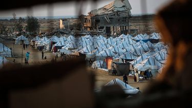 This picture shows shelters set up amid destroyed buildings at the Nuseirat camp for displaced Palestinians in the central Gaza Strip on December 4, 2025. The United States, alongside Qatar and Egypt, secured a truce in Gaza that came into effect on October 10 and has mostly halted two years of war between Israel and Palestinian militant group Hamas.
Eyad Baba / AFP