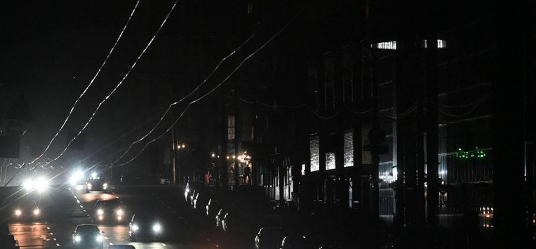 Cars drive in a dark street during a blackout in Kyiv on October 8, 2026, amid the Russian invasion in Ukraine. The Kyiv City State Administration said reduced voltage in the power grid had forced the temporary suspension of some public transport services in the capital.
Sergei SUPINSKY / AFP