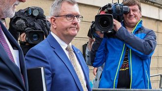 Former leader of Northern Ireland's main pro-UK Democratic Unionist Party (DUP), Jeffrey Donaldson (C) leaves court after the jury in his trial was sent home for the weekend, in Newry in Northern Ireland, on June 19, 2026. Donaldson, 63, who has pleaded not guilty to 18 charges of alleged historical sex offence, appeared at Newry Crown Court as proceedings in the high-profile case continue. Donaldson led the Democratic Unionist Party (DUP) from December 2019 until his resignation in March 2024, when he was charged by police.
Paul Faith / AFP
